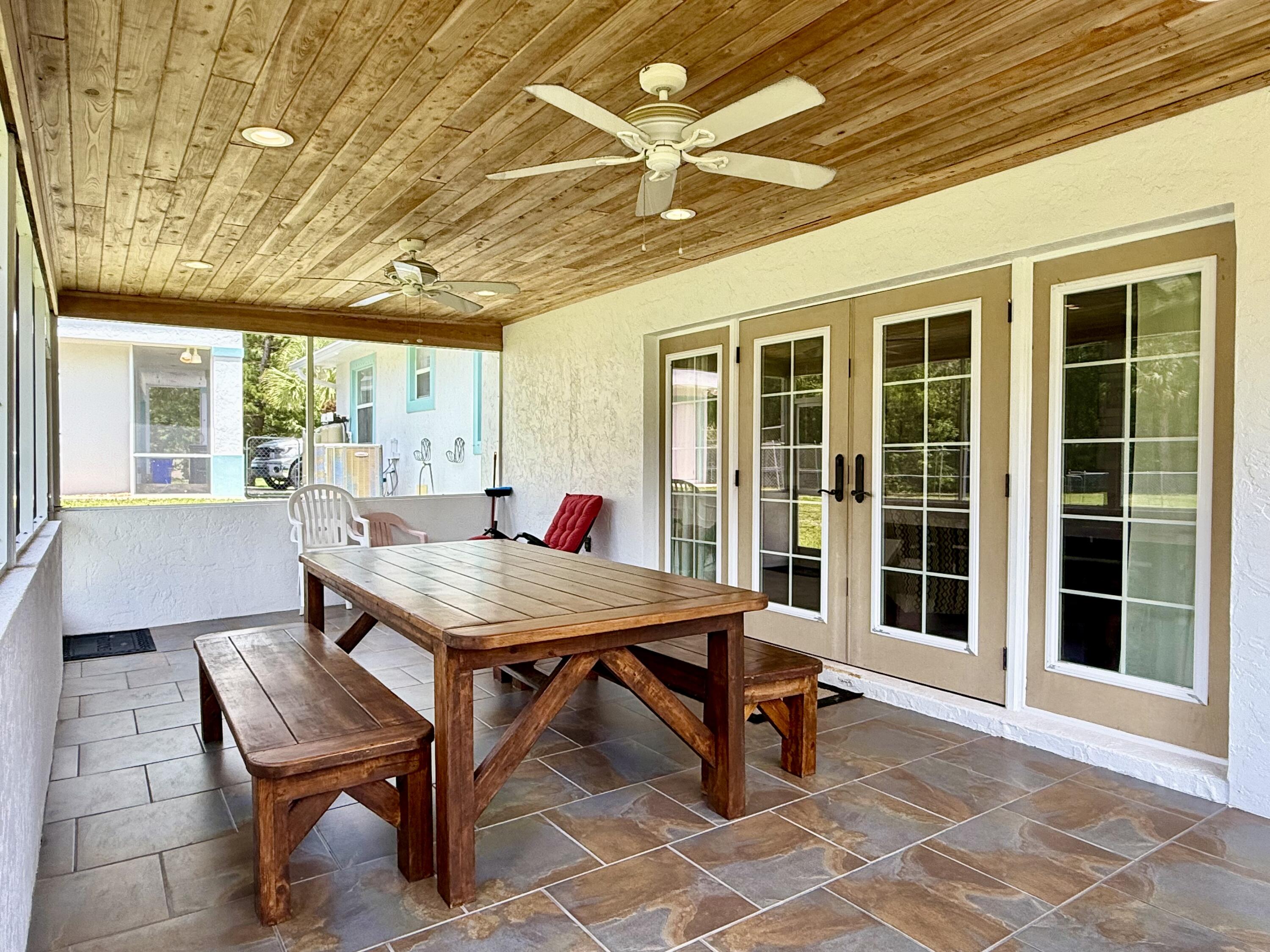 16283 Alexander Run Jupiter, FL 33478 - Photo 56 of 96 a view of a dining room with furniture window and outside view