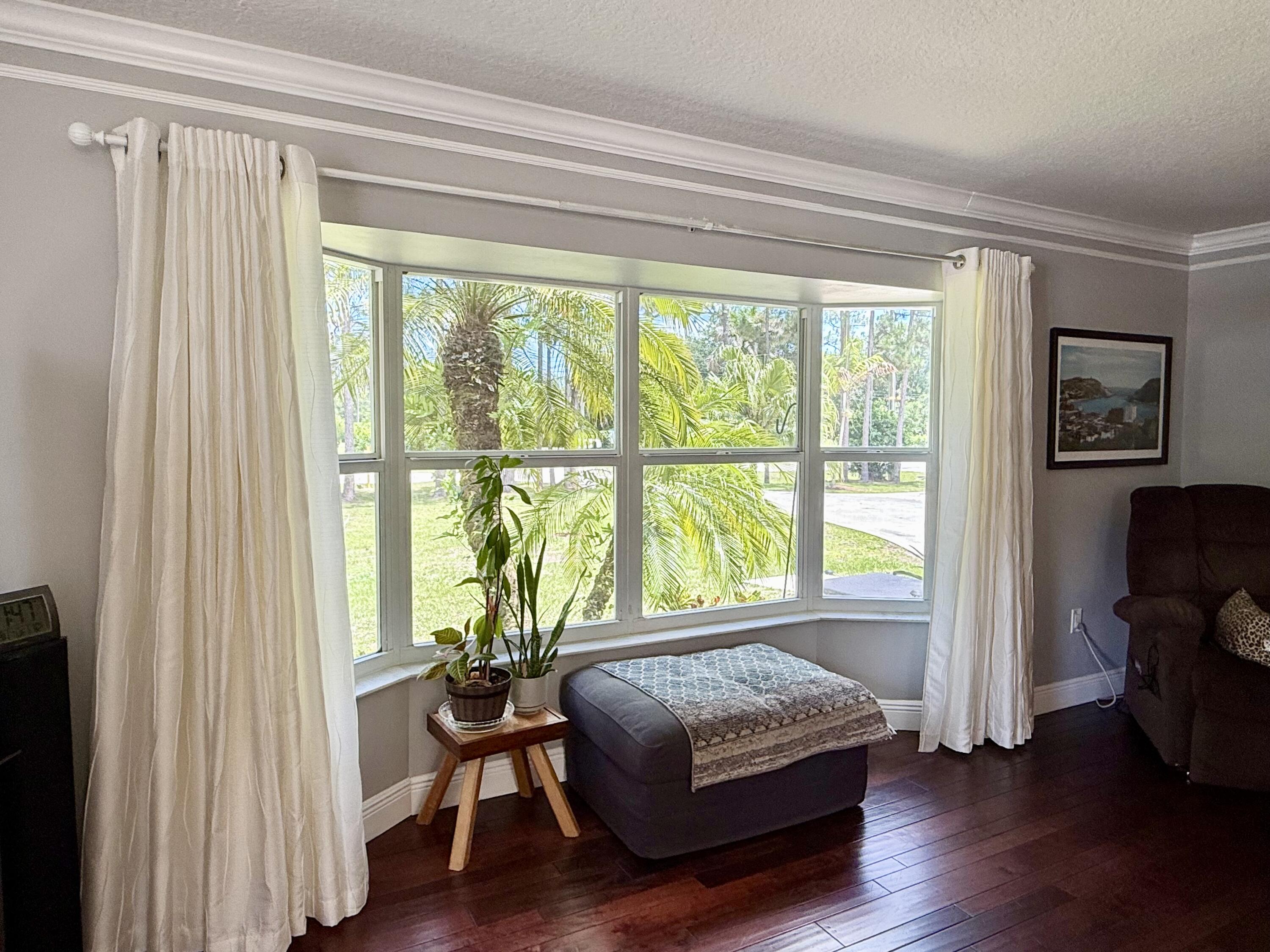 16283 Alexander Run Jupiter, FL 33478 - Photo 6 of 96 a living room with couch and a window