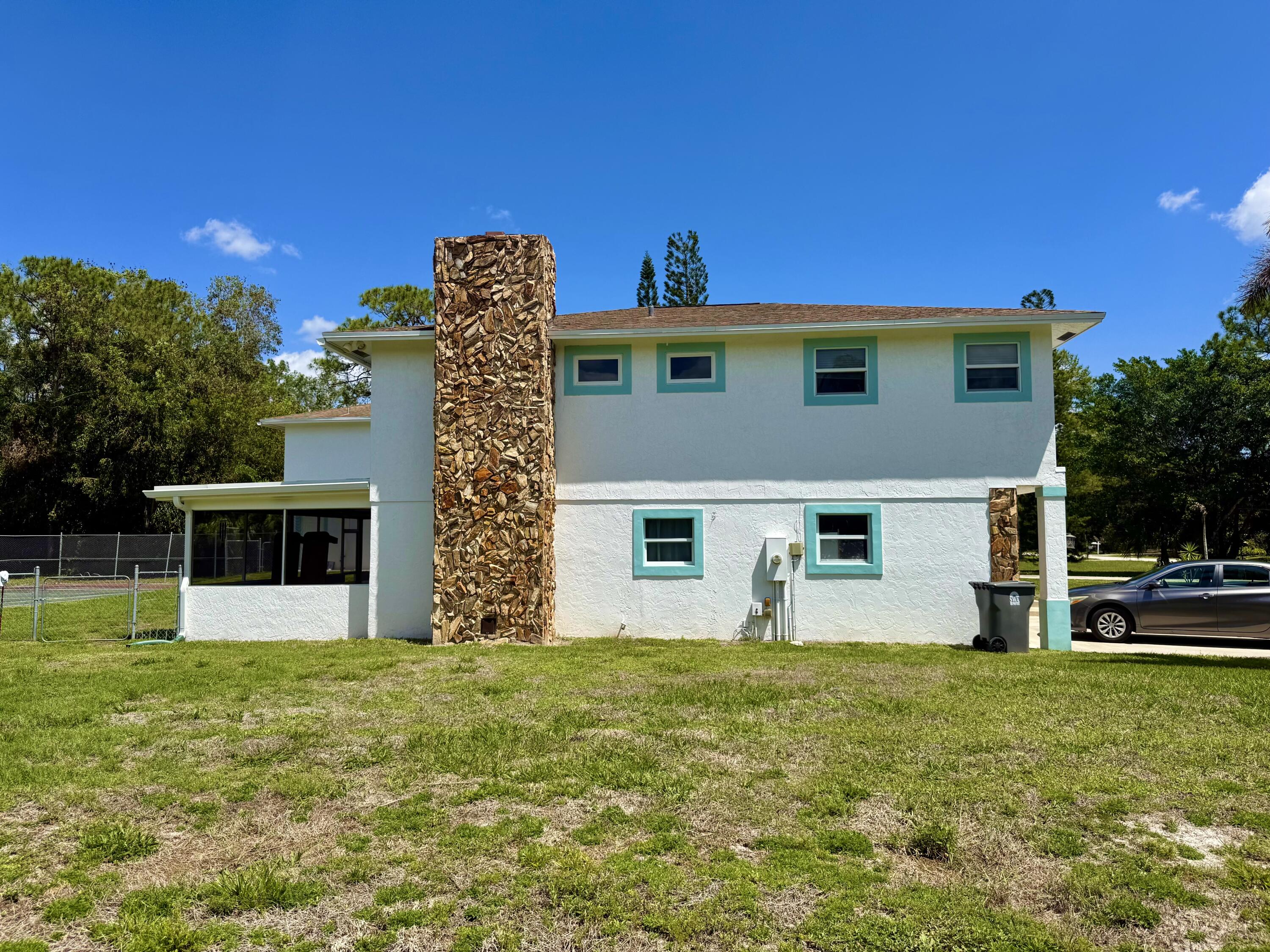 16283 Alexander Run Jupiter, FL 33478 - Photo 7 of 14 Main House Side