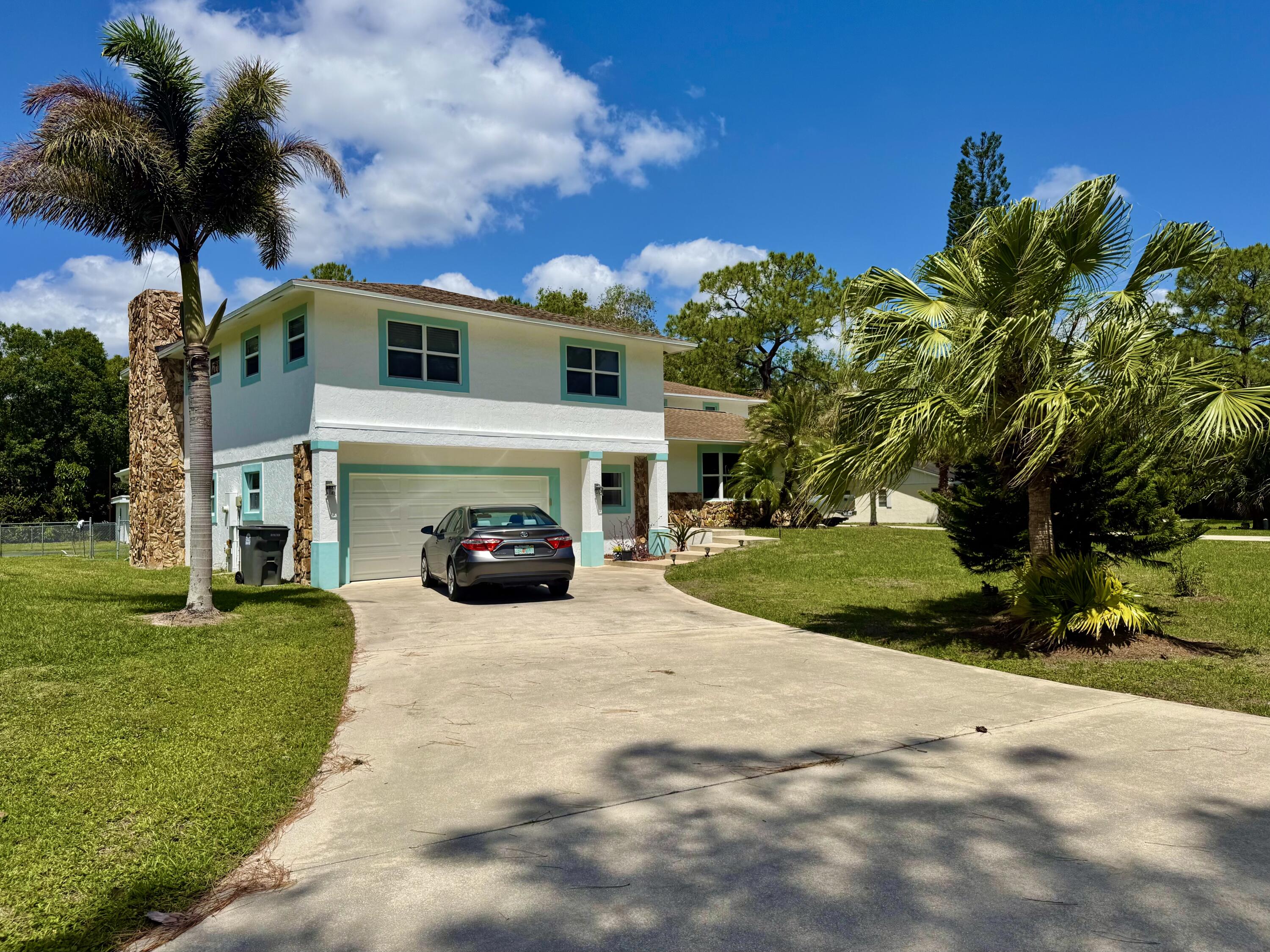 16283 Alexander Run Jupiter, FL 33478 - Photo 8 of 14 Driveway Main House