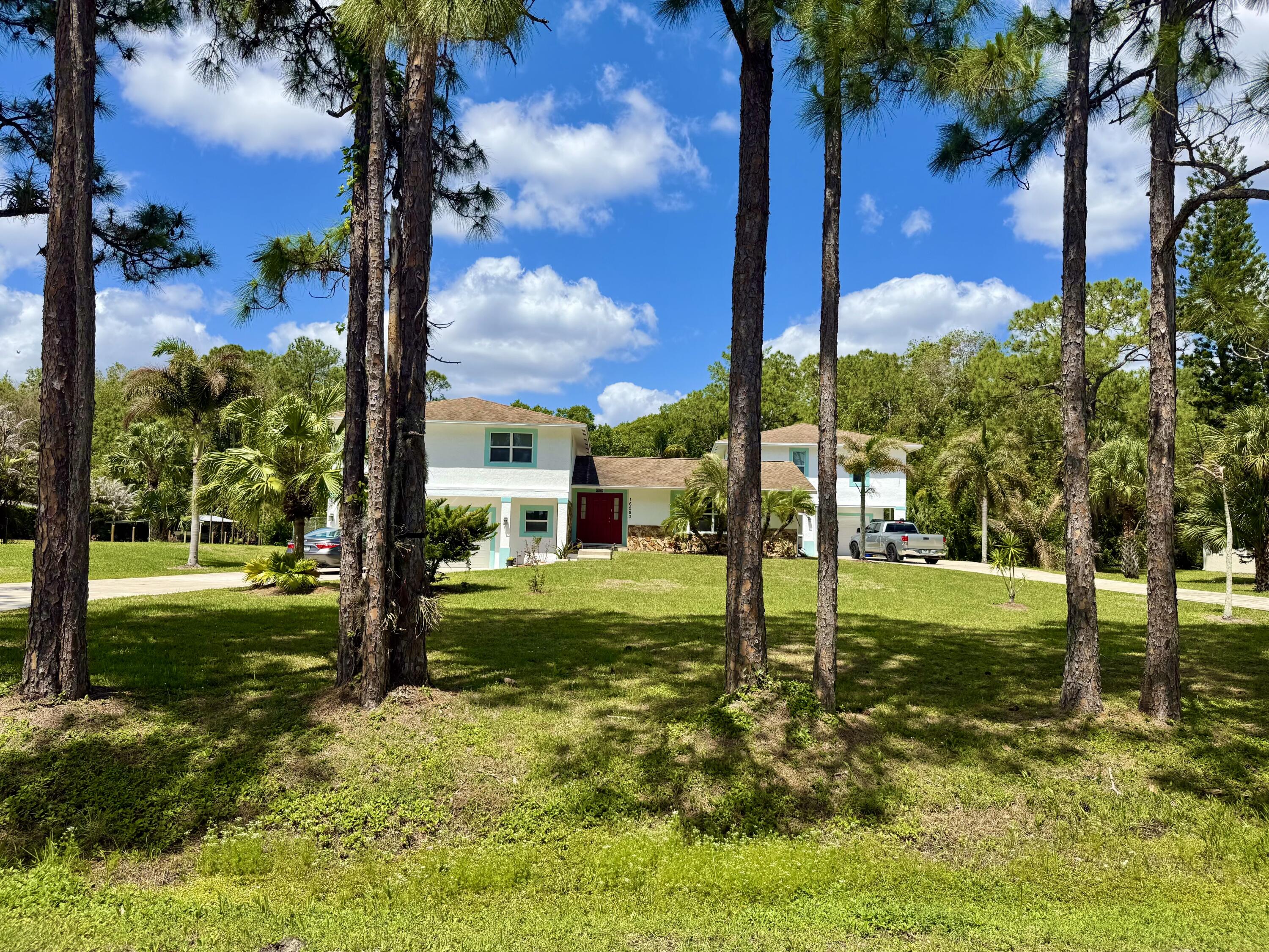 16283 Alexander Run Jupiter, FL 33478 - Photo 86 of 96 a view of a garden with a tree