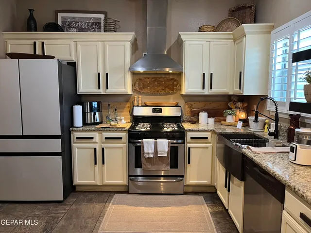 a kitchen with a sink cabinets and window