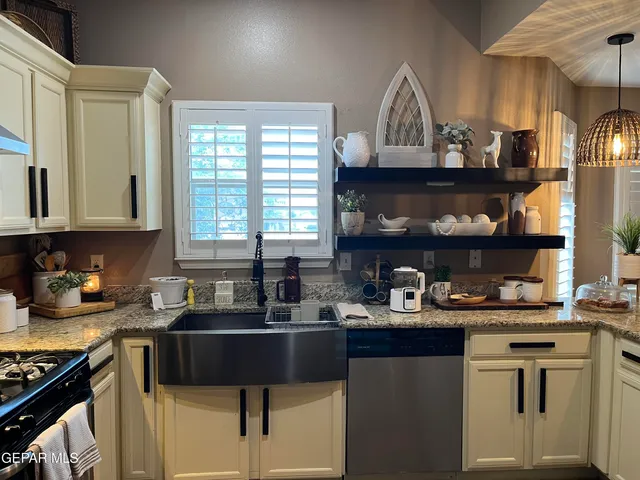 a kitchen with cabinets and window