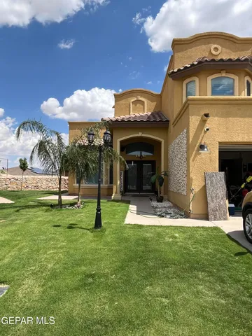 a front view of a house with garden