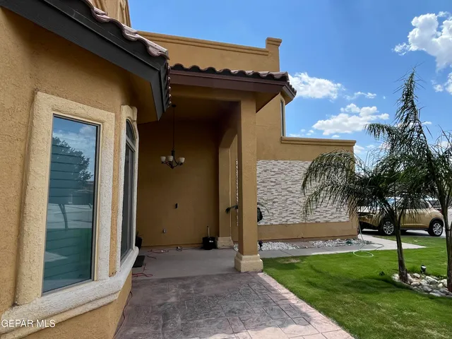 a dining room with a table and chairs
