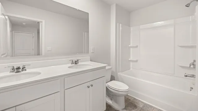 a bathroom with a sink a toilet and a bathtub