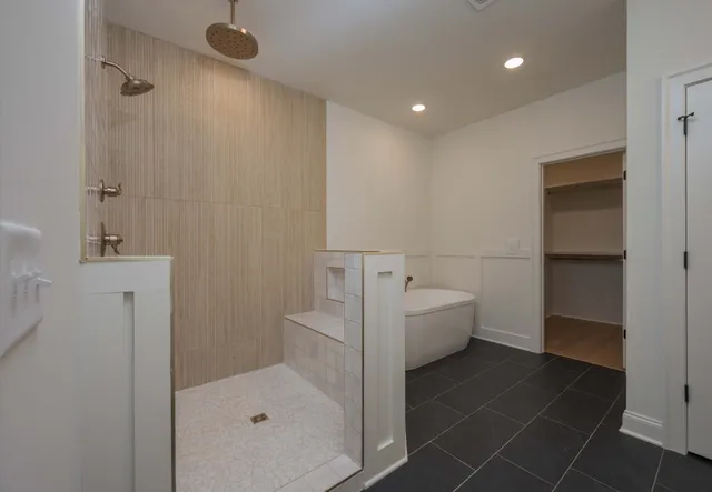 a bathroom with a bathtub and shower