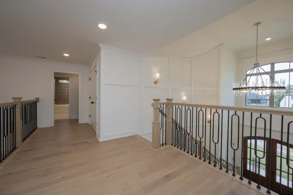 a view of hallway with wooden floor
