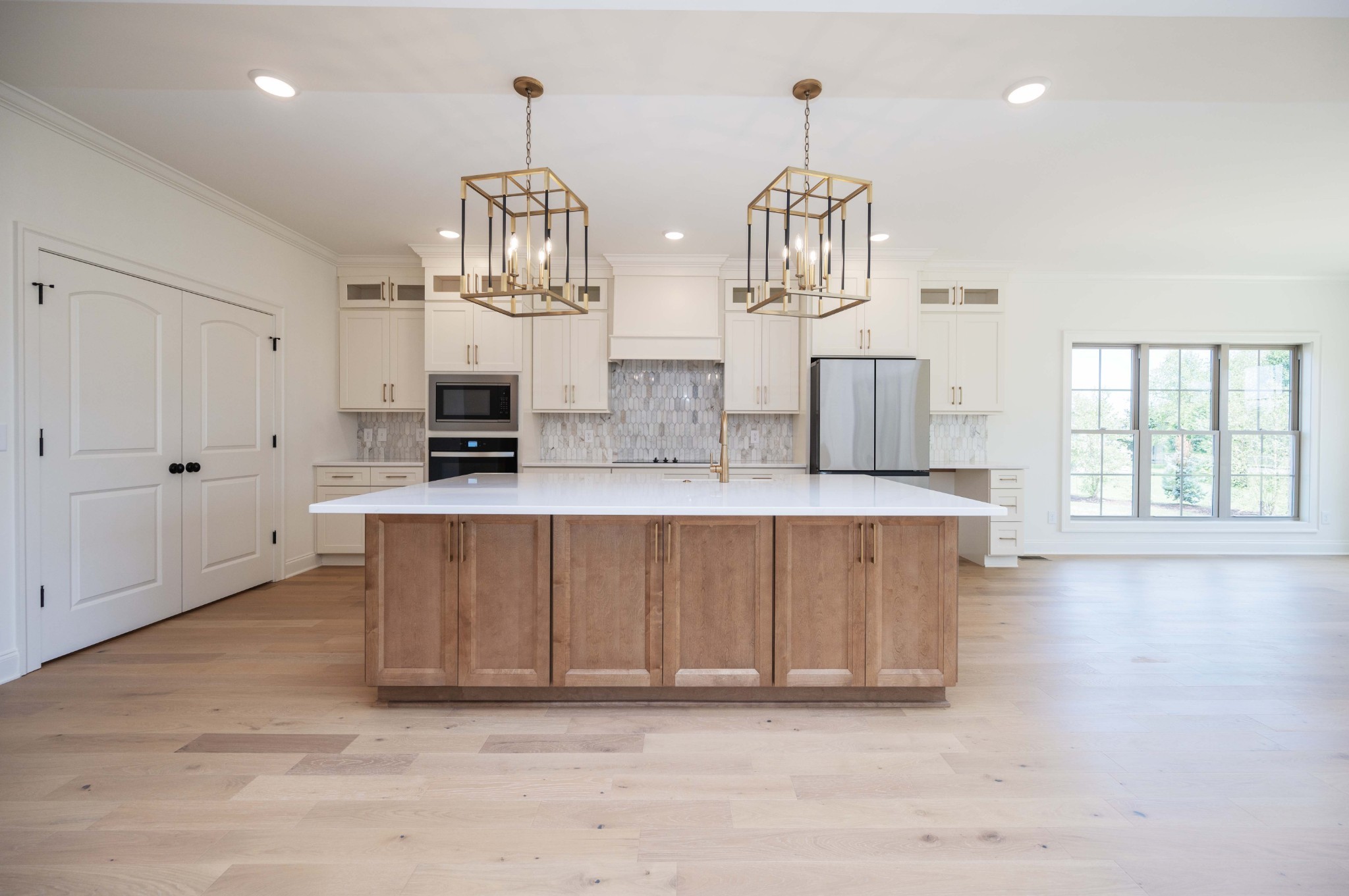 0 Ramsey Road Morrison, TN 37357 - Photo 8 of 53 a large kitchen with kitchen island white cabinets and wooden floor