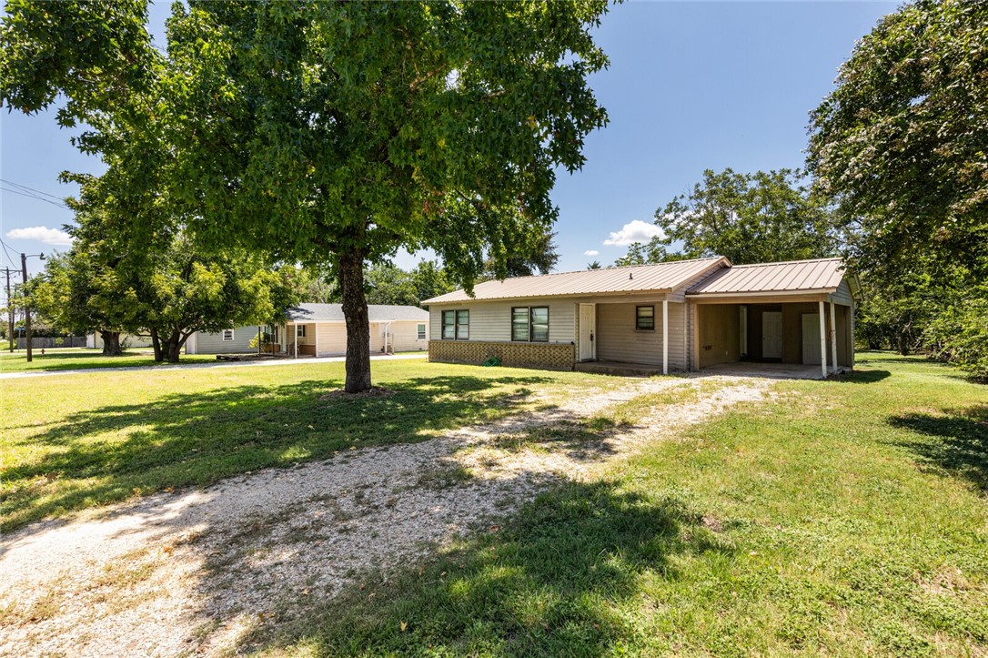 1211 South Old Robinson Road Robinson, TX 76706 - Photo 2 of 26 a front view of a house with a garden