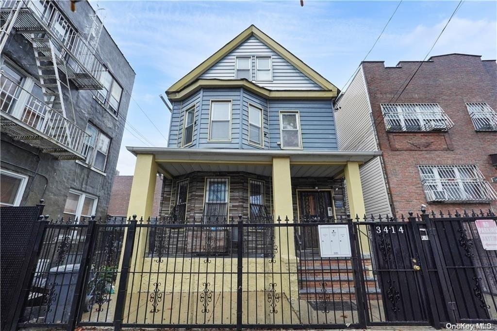 a view of a house with iron stairs