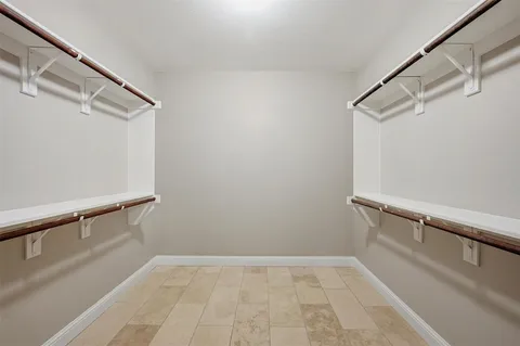 a view of a hallway to a bedroom and stairs