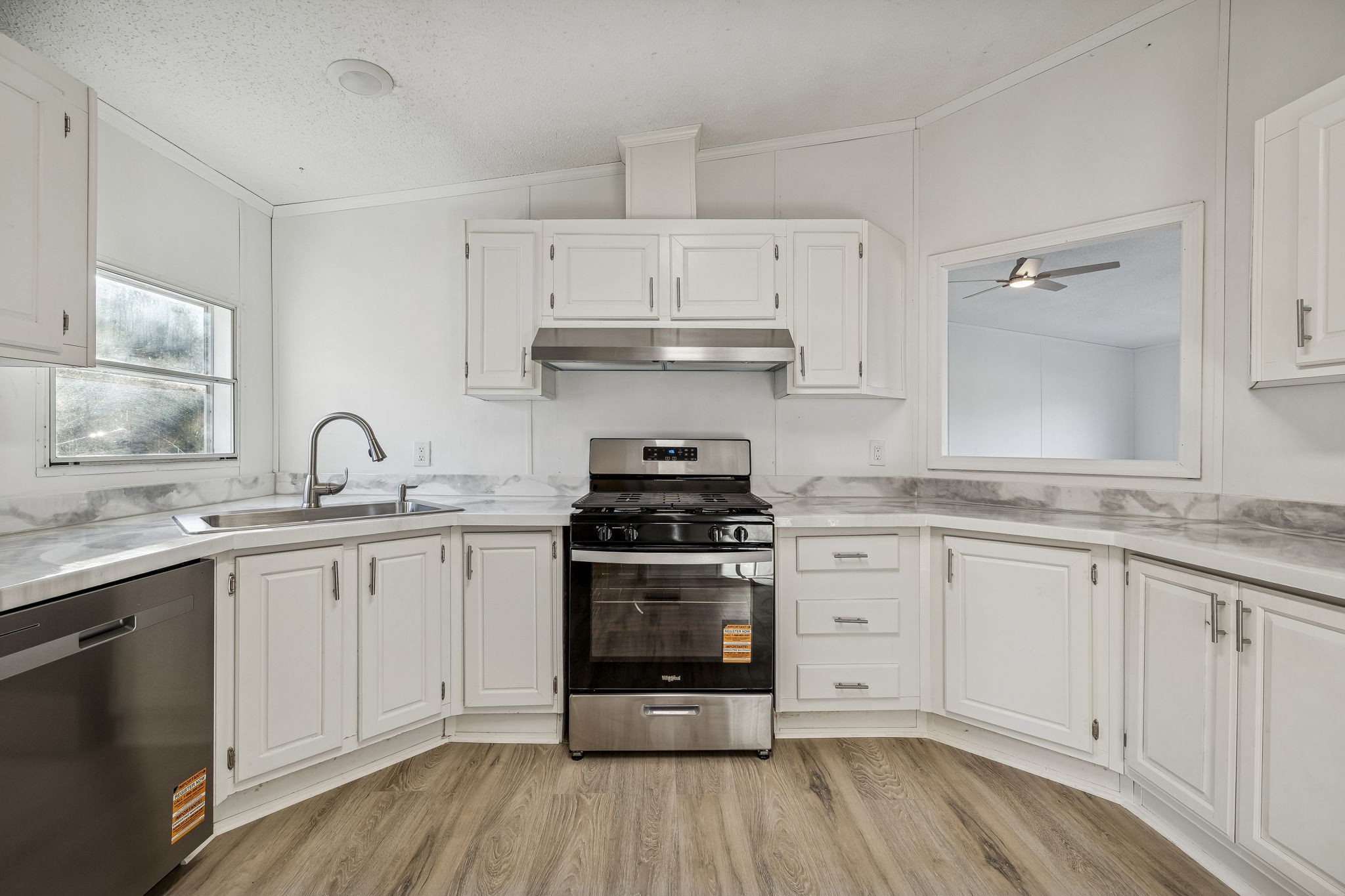 145 Milk Barn Road Cookeville, TN 38506 - Photo 13 of 43 a kitchen with granite countertop a stove and a sink