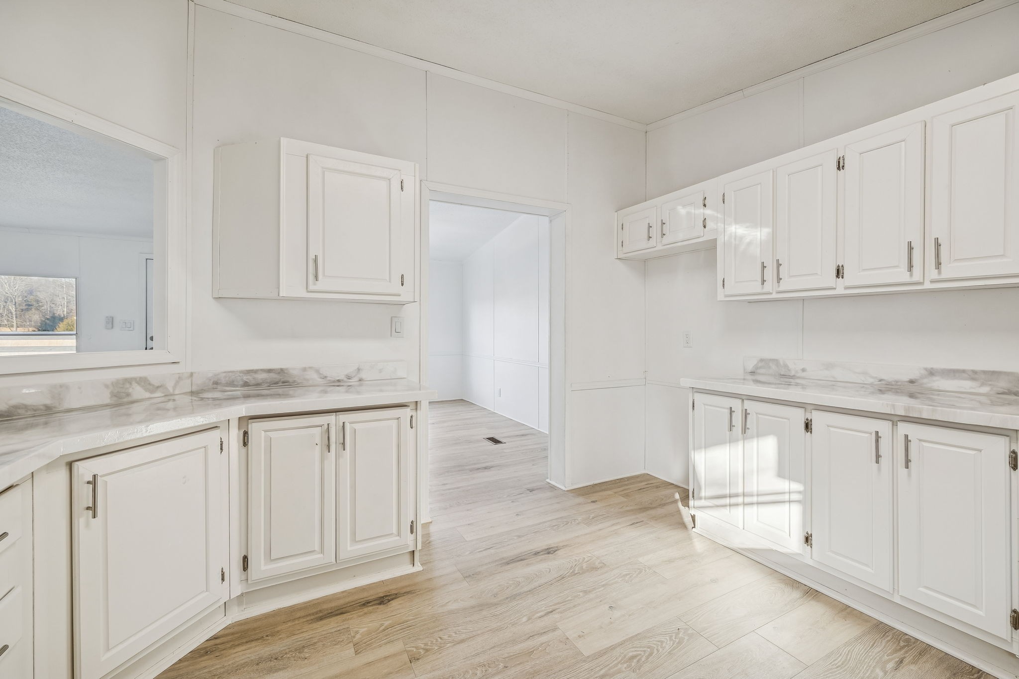 145 Milk Barn Road Cookeville, TN 38506 - Photo 15 of 43 a kitchen with granite countertop white cabinets white appliances and granite counter tops