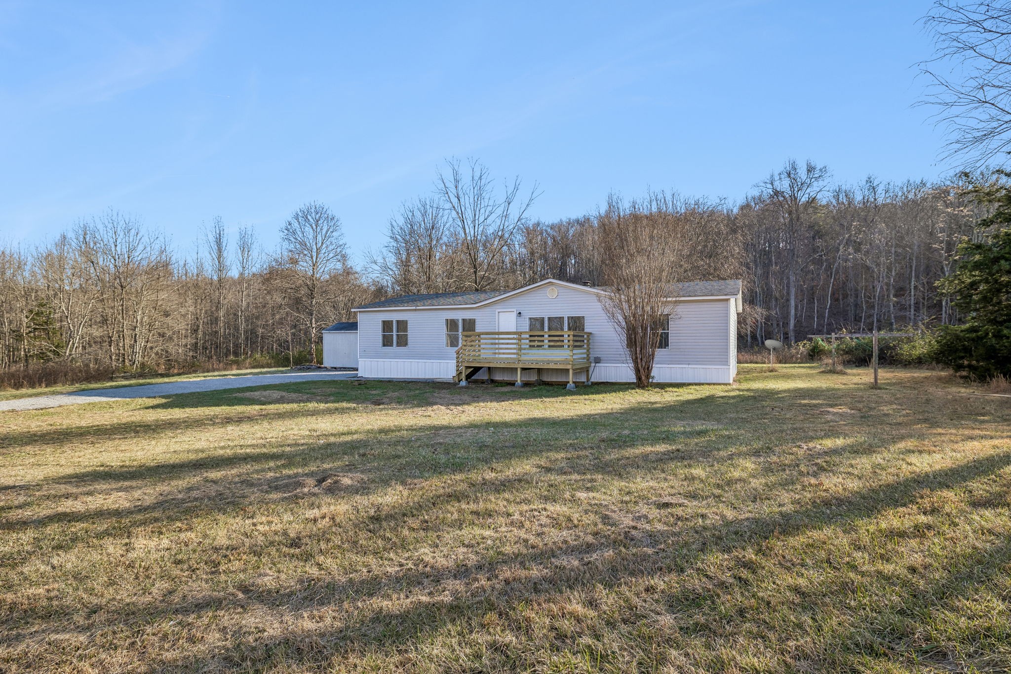 145 Milk Barn Road Cookeville, TN 38506 - Photo 2 of 43 a front view of house with yard and trees