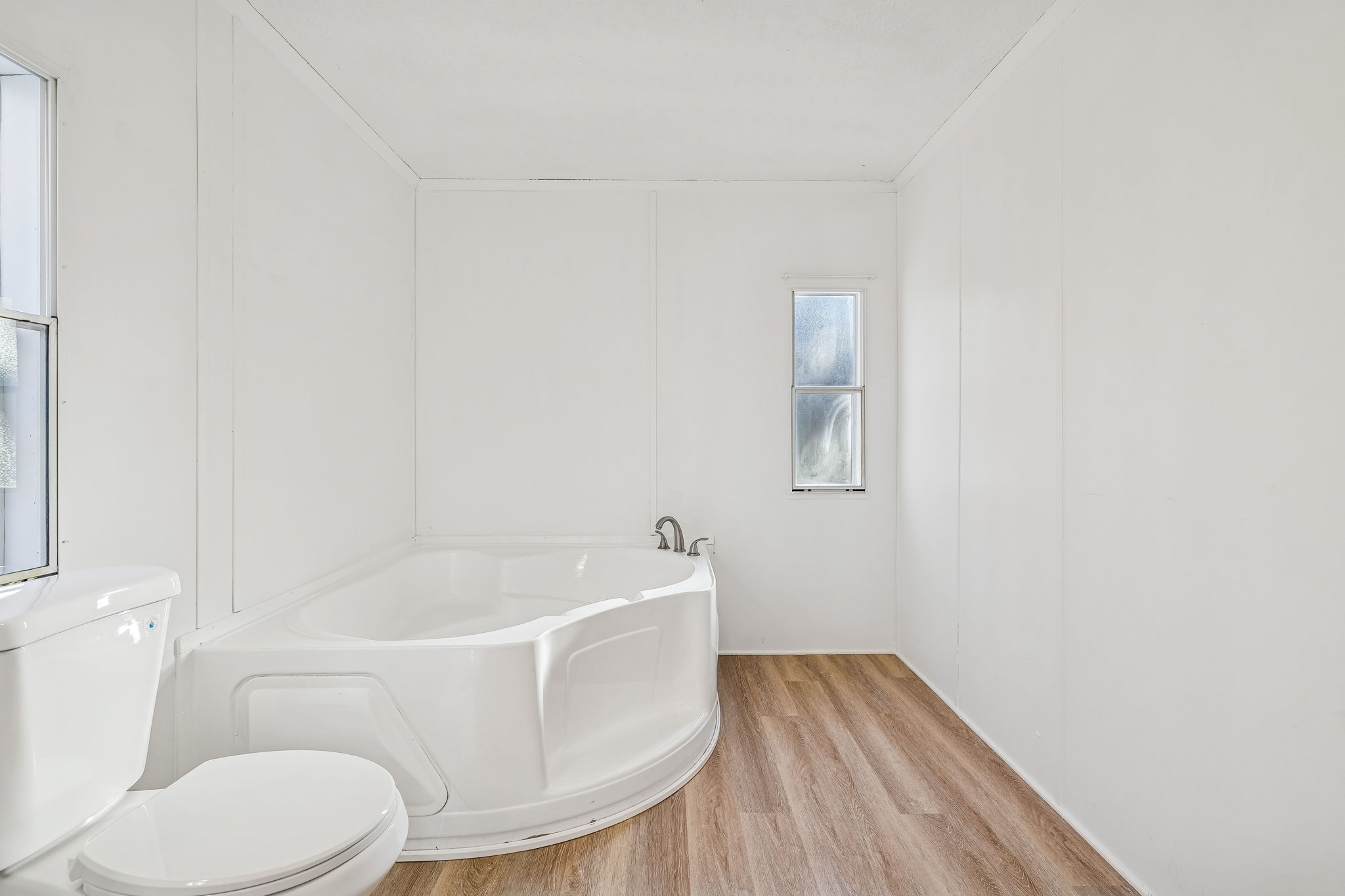 145 Milk Barn Road Cookeville, TN 38506 - Photo 21 of 43 a white toilet sitting next to a bath tub