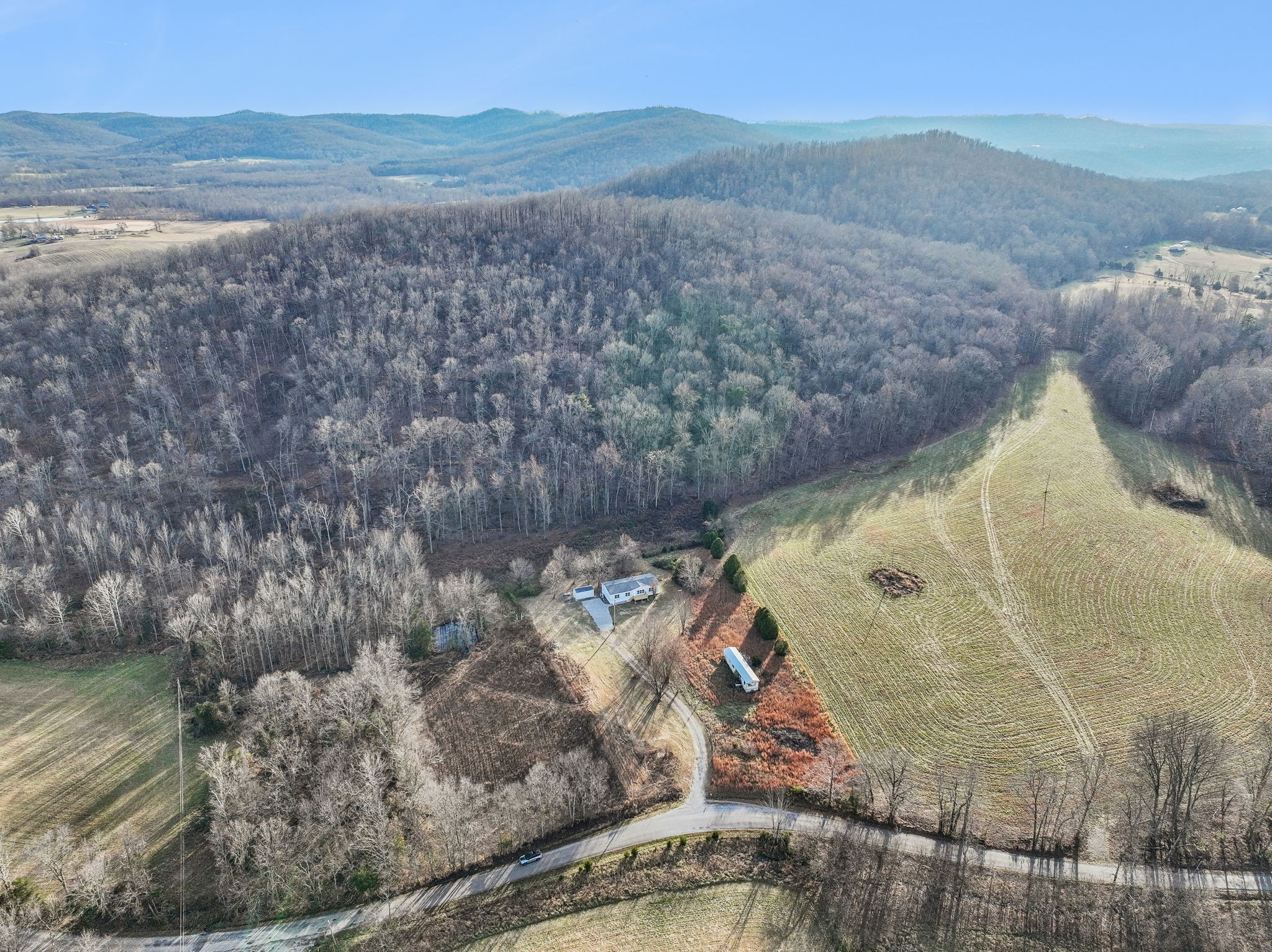 145 Milk Barn Road Cookeville, TN 38506 - Photo 38 of 43 a view of a lake from a yard