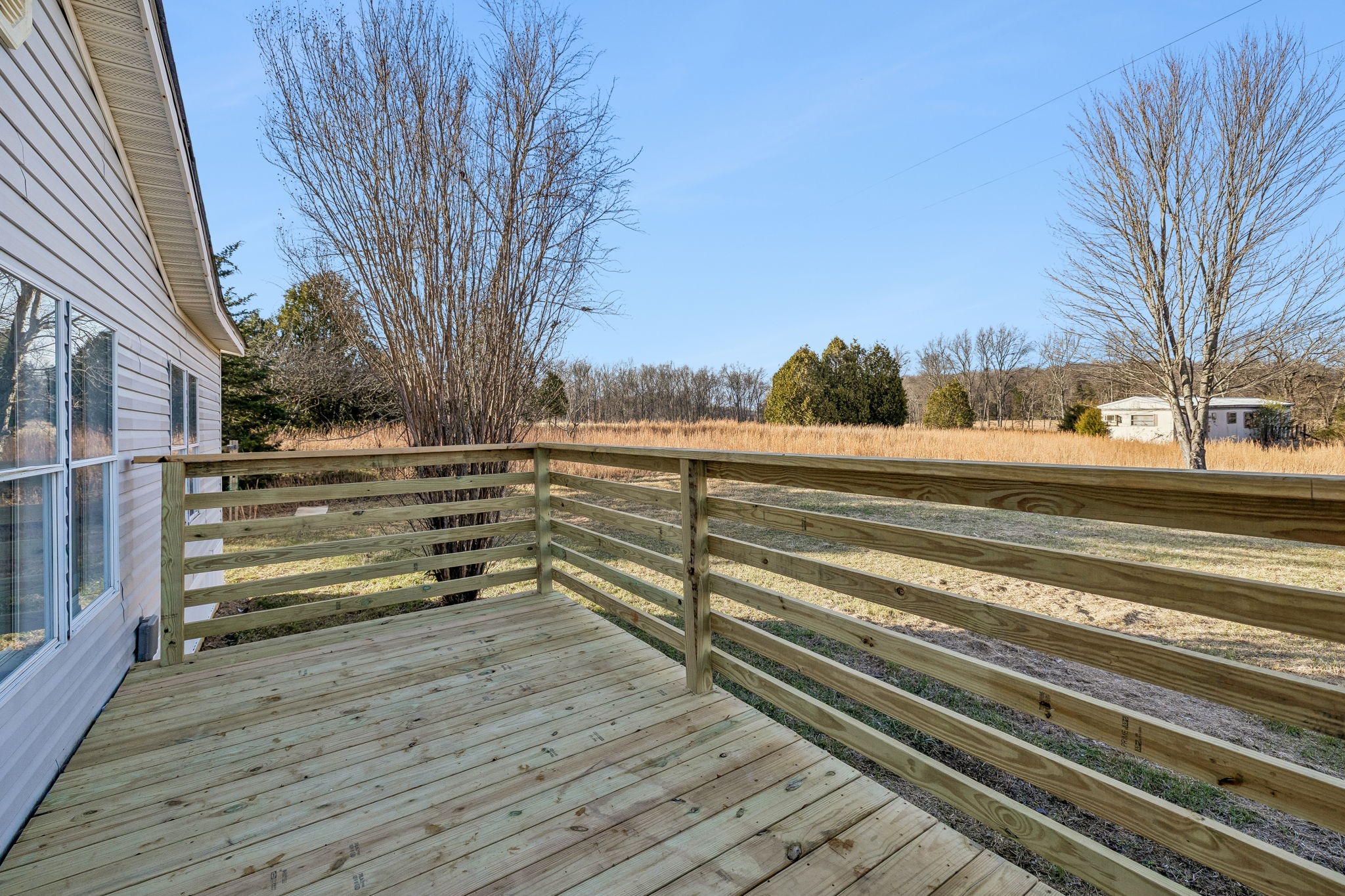 145 Milk Barn Road Cookeville, TN 38506 - Photo 4 of 43 a view of a yard with wooden floor and fence