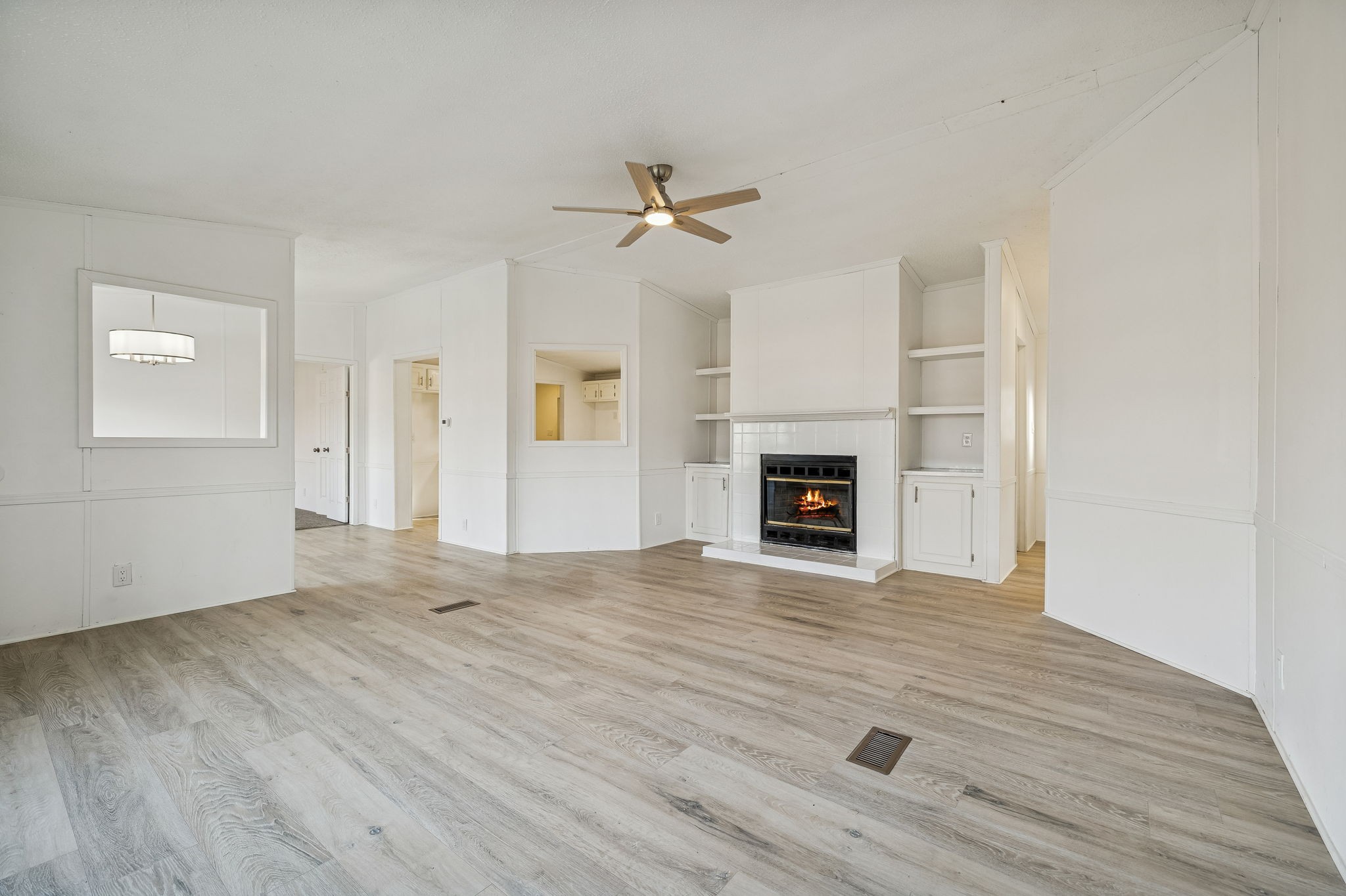 145 Milk Barn Road Cookeville, TN 38506 - Photo 8 of 43 a view of empty room with wooden floor and fireplace