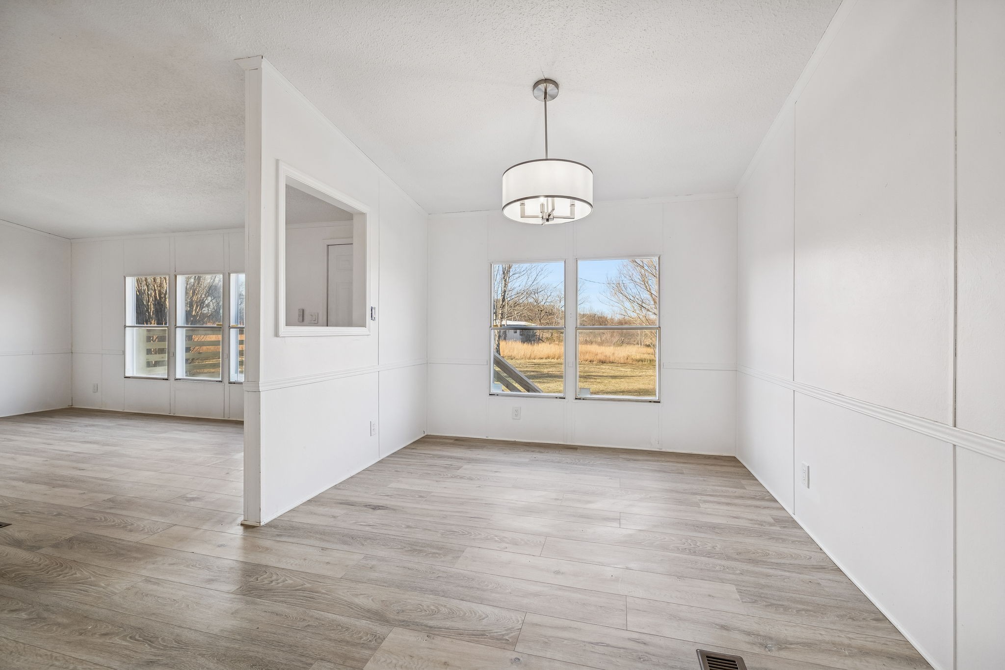 145 Milk Barn Road Cookeville, TN 38506 - Photo 9 of 43 an empty room that has a chandelier and a chandelier