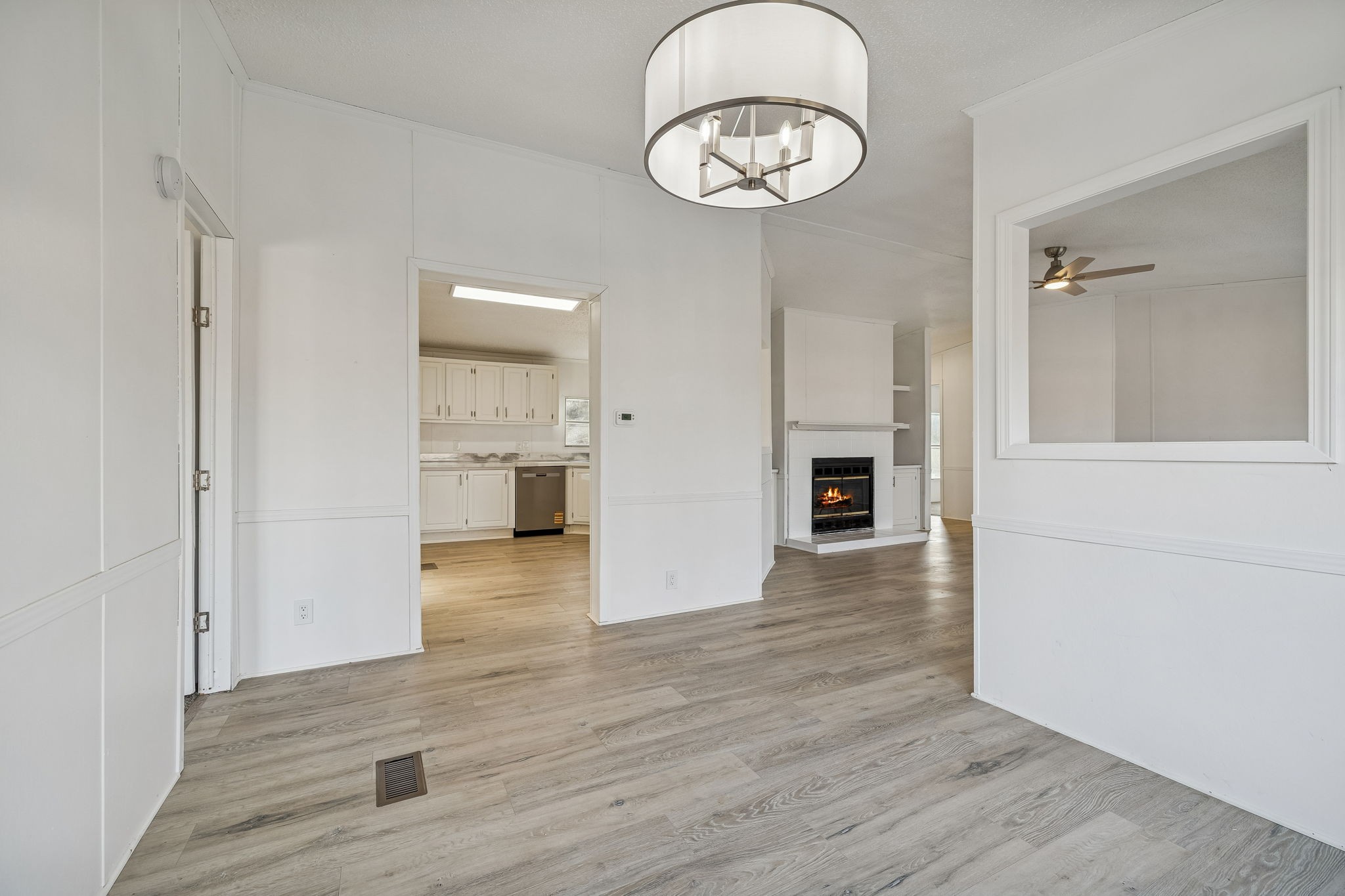 145 Milk Barn Road Cookeville, TN 38506 - Photo 10 of 43 an empty room with wooden floor and ceiling fan