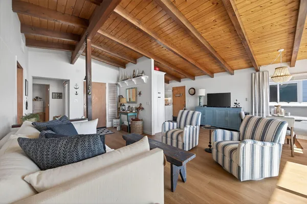 a kitchen with stainless steel appliances a stove a microwave and a refrigerator