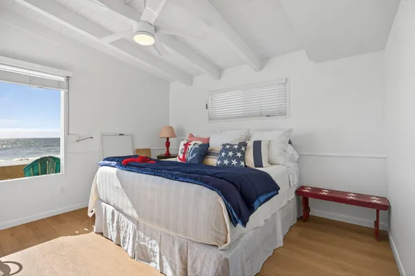 a bedroom with bed and a window