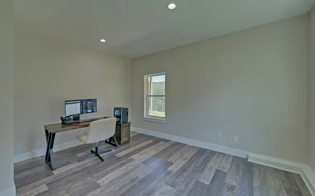 a workspace with furniture and wooden floor