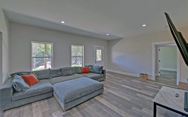 a bathroom with a sink vanity mirror and toilet