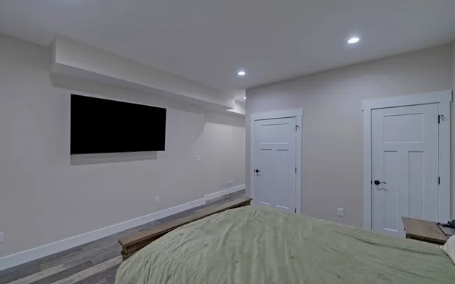 a bathroom with a double vanity sink mirror and shower