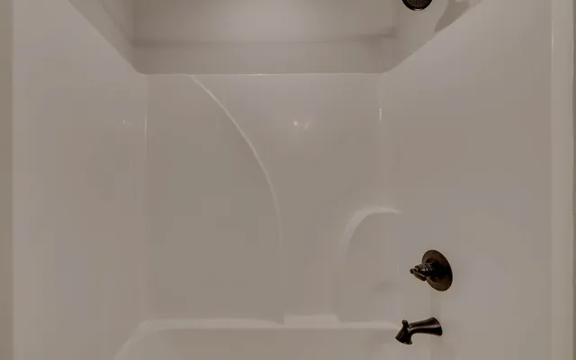 a bathroom with a sink double vanity and a mirror