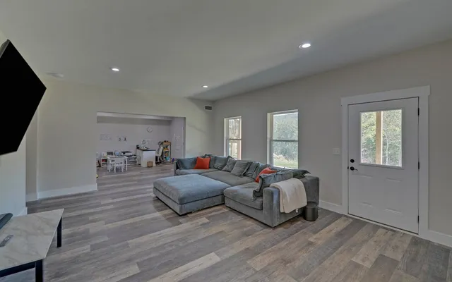 a view of walk in closet with clothes