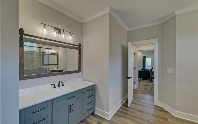 an aerial view of a house with a yard and trees