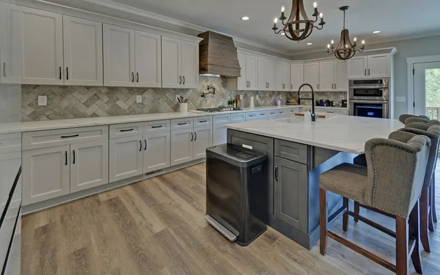 a kitchen with a stove and cabinets