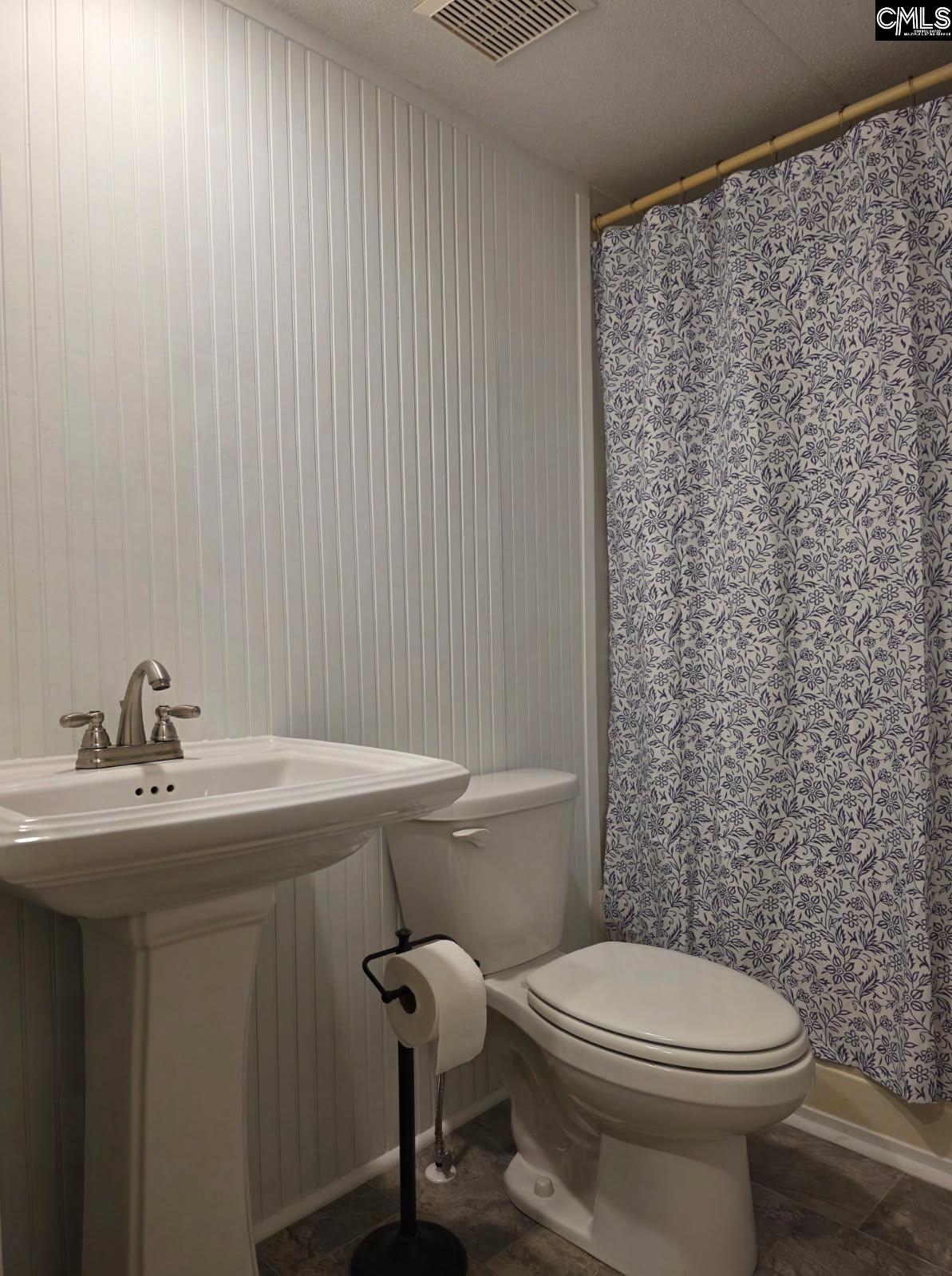 624 Lawson Road Leesville, SC 29070 - Photo 25 of 35 a bathroom with a sink a toilet and mirror