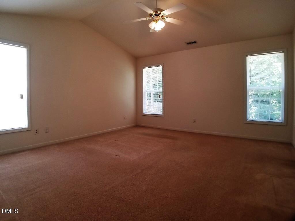 2100 Ramsgate Street Raleigh, NC 27603 - Photo 10 of 13 an empty room with windows and fan