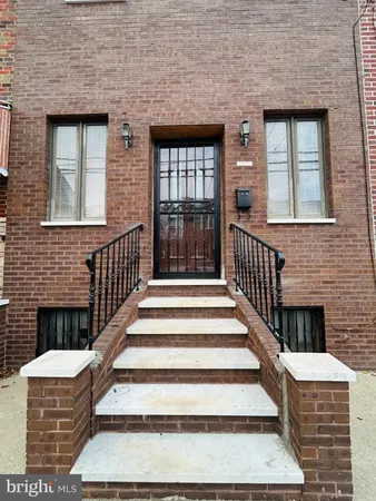 a front view of a house with stairs