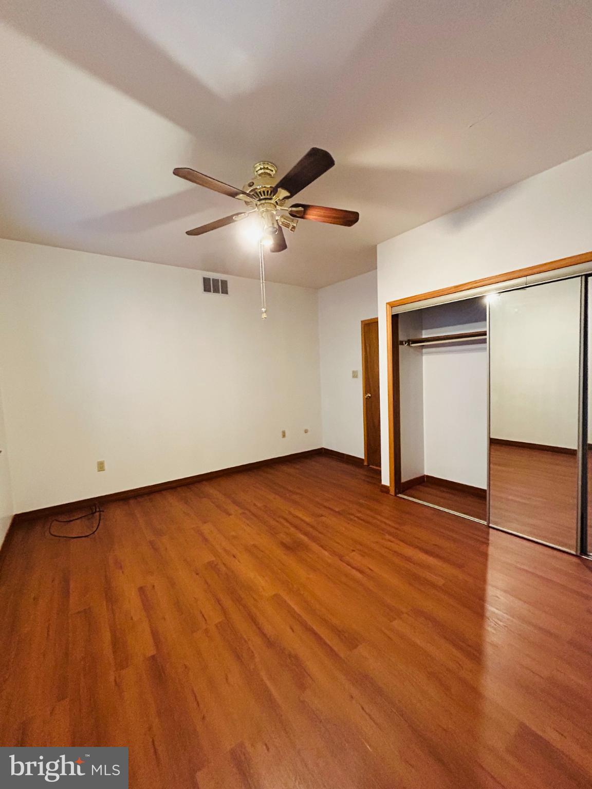 1507 West Shunk Street Philadelphia, PA 19145 - Photo 15 of 31 Spacious room with warm wood flooring.