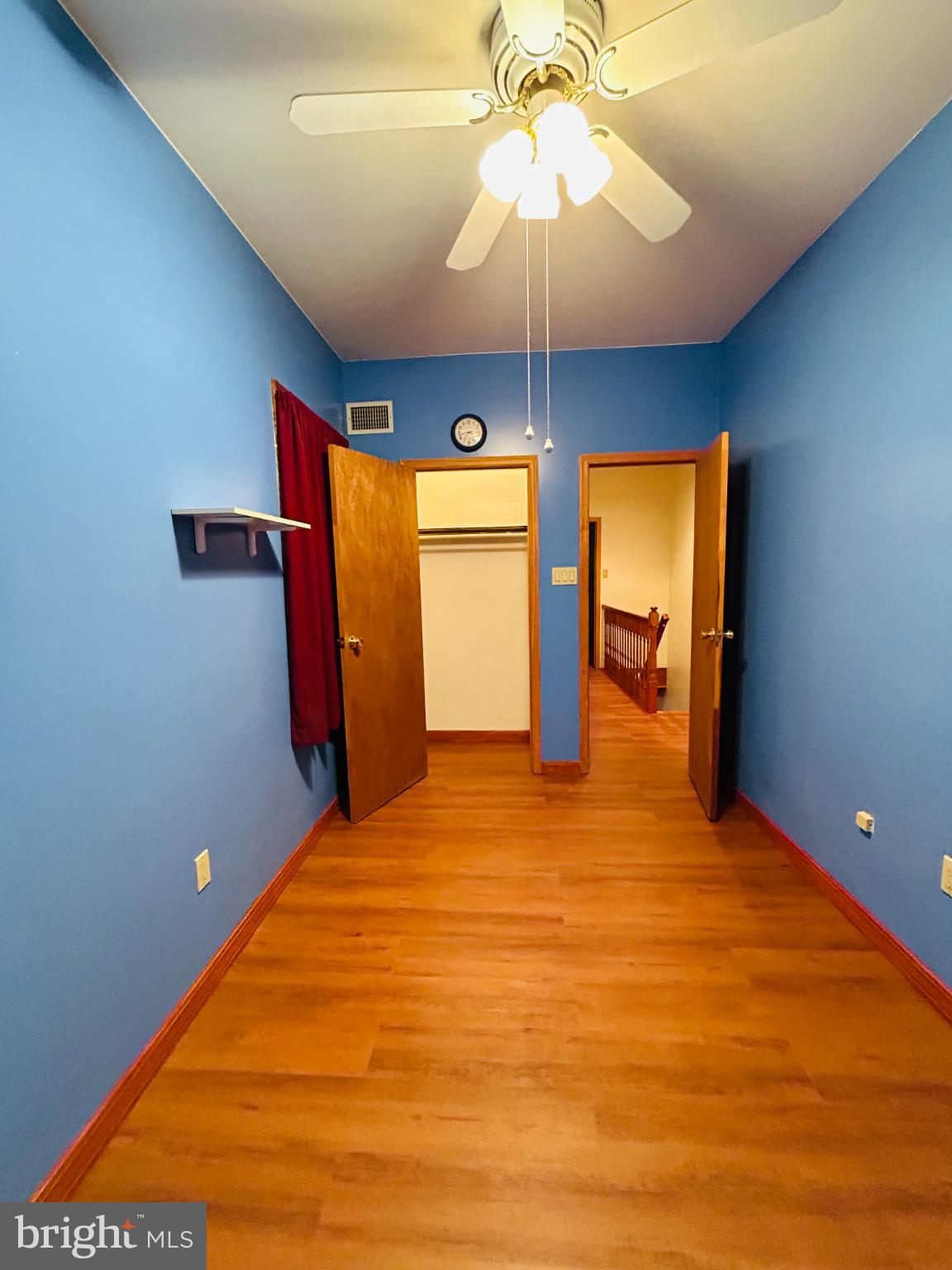 1507 West Shunk Street Philadelphia, PA 19145 - Photo 18 of 31 Bright blue room with warm wooden floors.