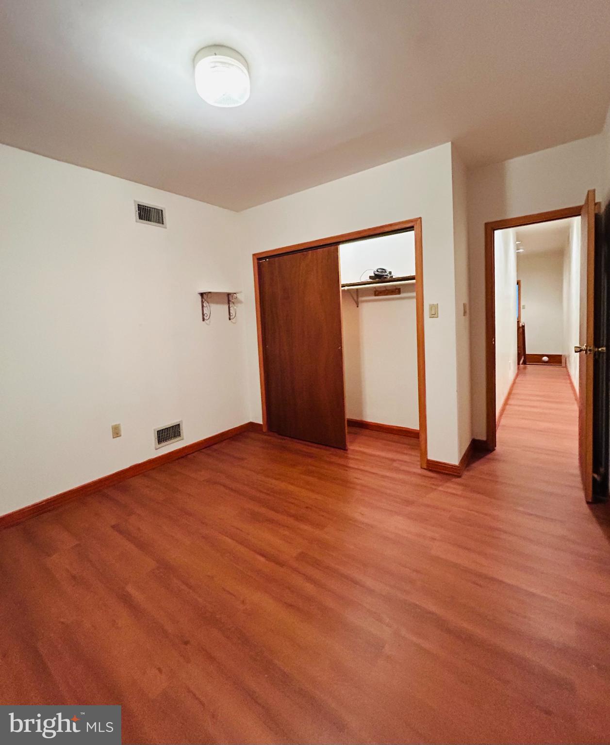 1507 West Shunk Street Philadelphia, PA 19145 - Photo 20 of 31 Spacious room with warm wooden floors.
