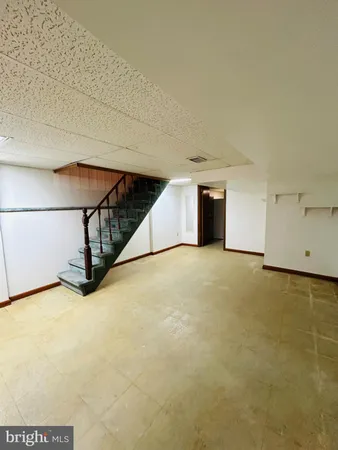 a view of an empty room with windows