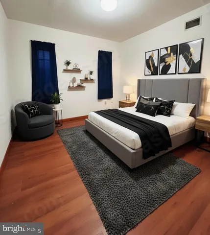 a bedroom with bed and window