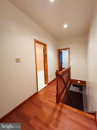 a view of a livingroom with furniture and wooden floor