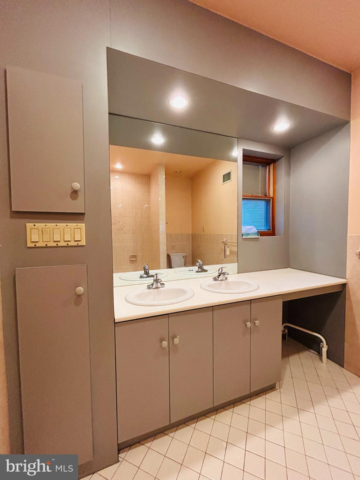 1507 West Shunk Street Philadelphia, PA 19145 - Photo 10 of 31 Sleek dual-sink bathroom with modern finishes.