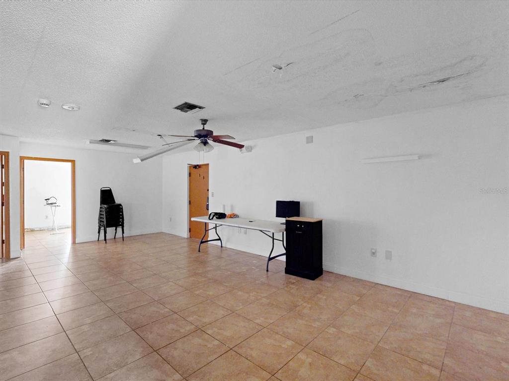 3425 Forsyth Road Winter Park, FL 32792 - Photo 23 of 40 a view of a livingroom with furniture and a ceiling fan