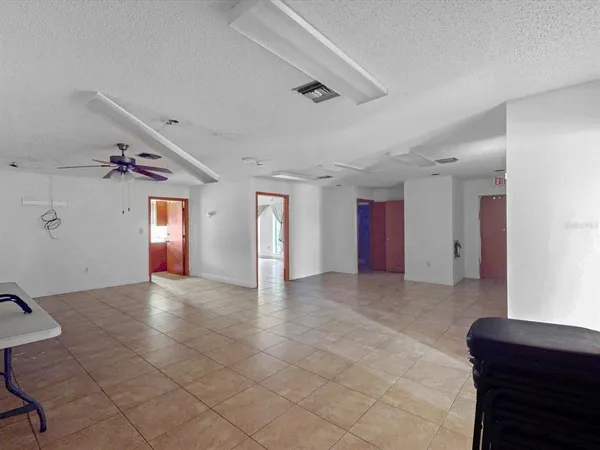 a view of an empty room and windows