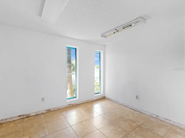 a view of a hallway with windows