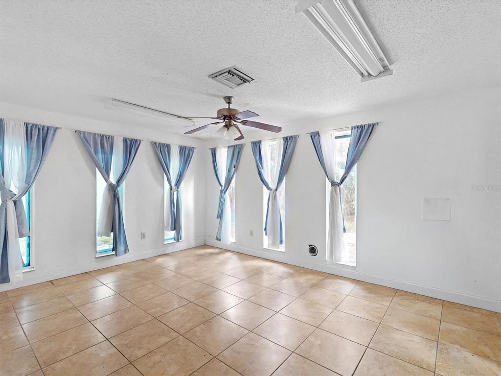 3425 Forsyth Road Winter Park, FL 32792 - Photo 26 of 40 a view of an empty room and windows