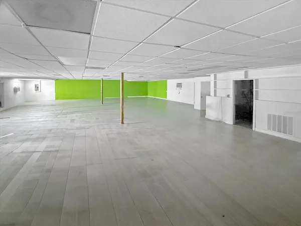 a view of house with a yard