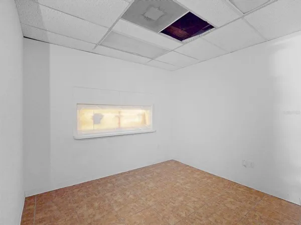 a bathroom with a shower and a sink